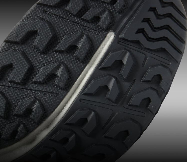 Closeup view of all-terrain tread on NXIS hiking shoe. 