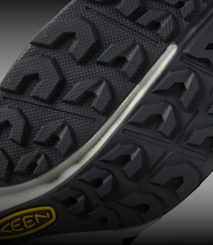 Closeup view of all-terrain tread on NXIS hiking shoe. 