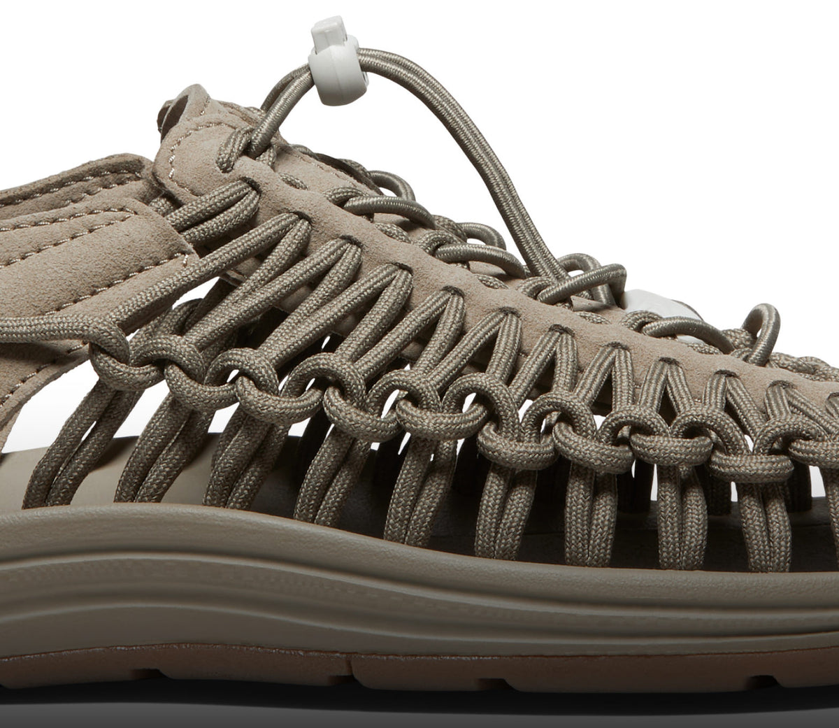 A close-up of a taupe-colored KEEN UNEEK sandal.
