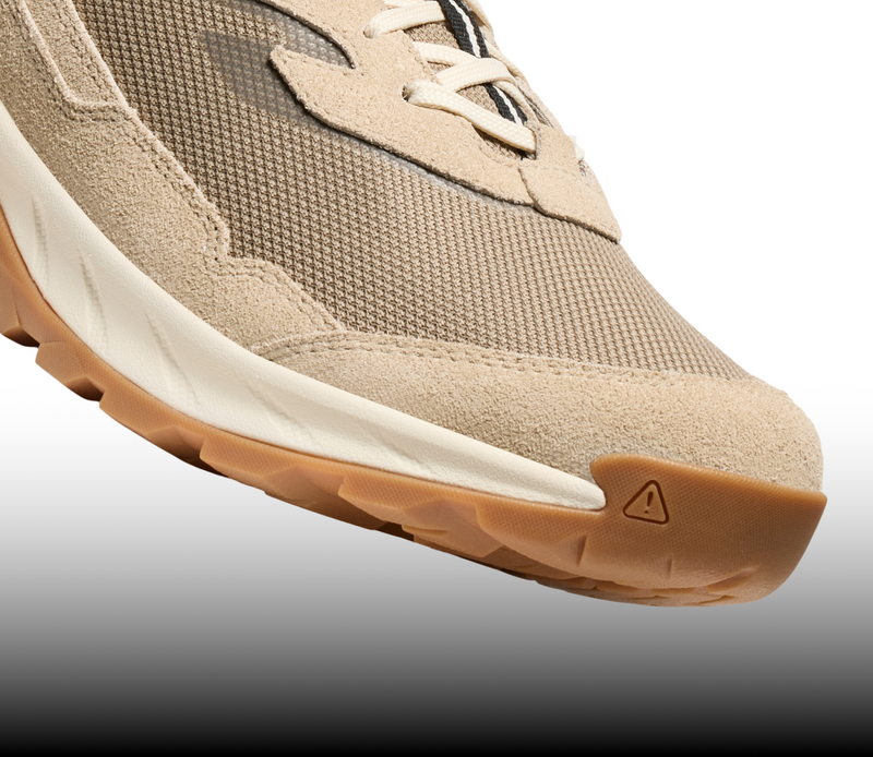 A close-up of the toe of a light brown Hightrail sneaker.