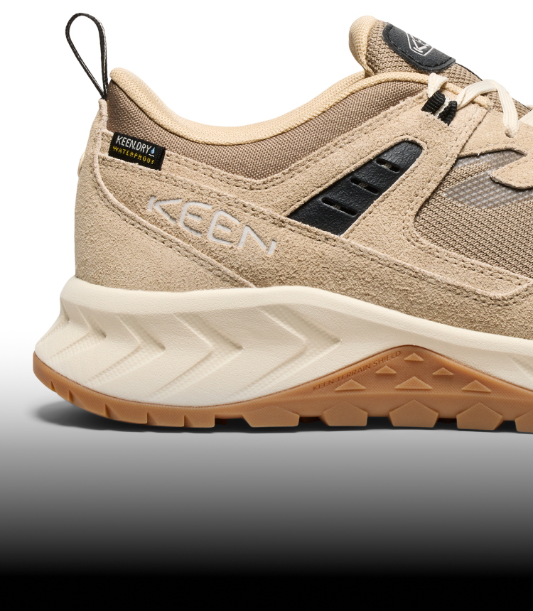 A close-up of the brown and cream-colored outsole of a Hightrail hiking sneaker.