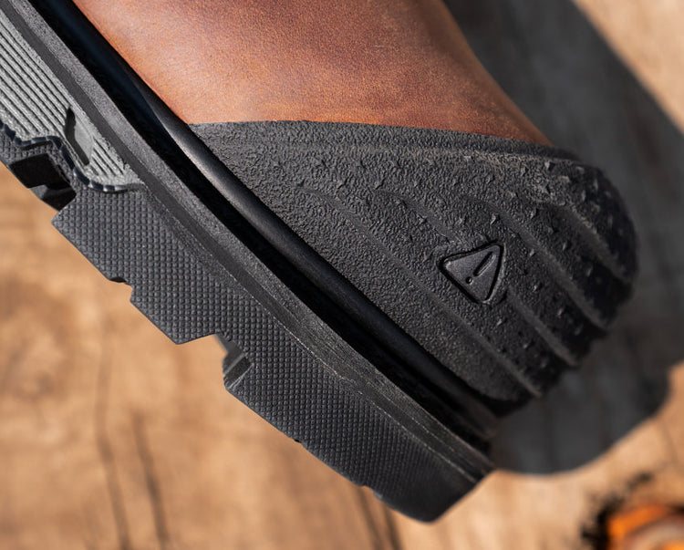 Closeup view of satey toe-guard stamp on toe box of Camden work boot