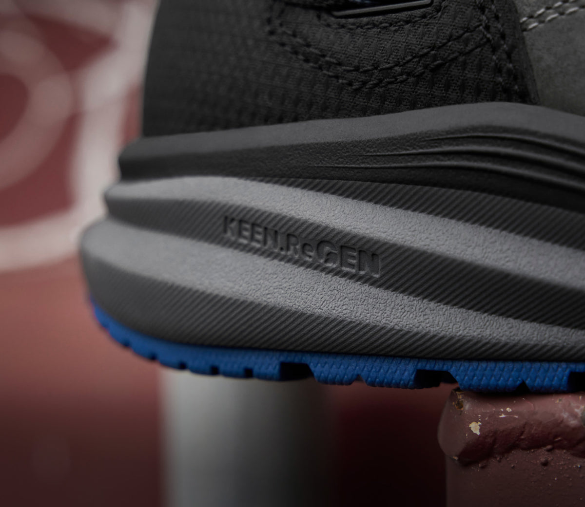 A close-up of the sole of a KEEN work shoe featuring Re.GEN technology.