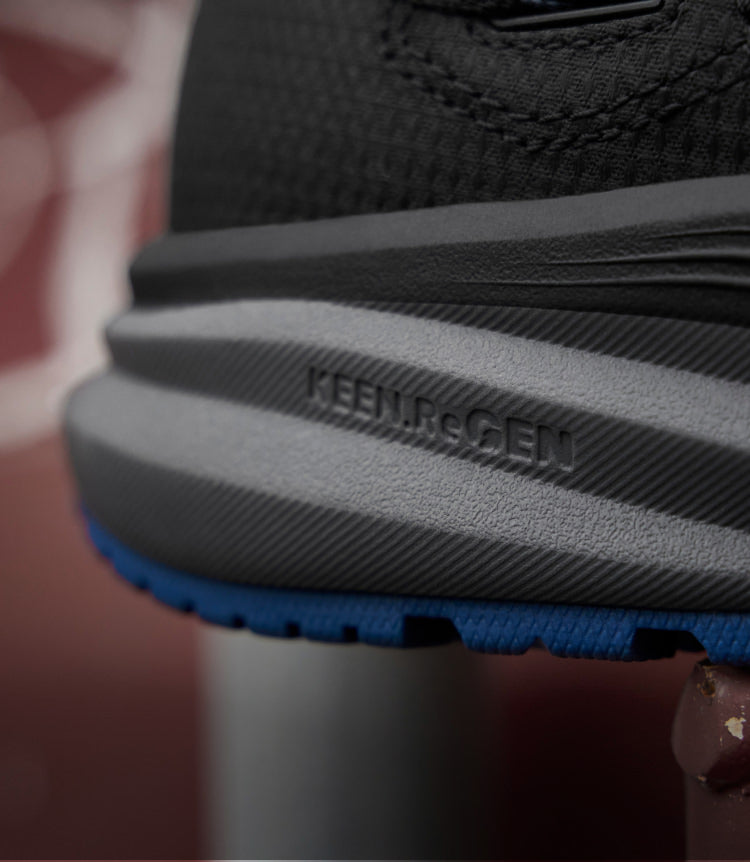 A close-up of the sole of a KEEN work shoe featuring Re.GEN technology.