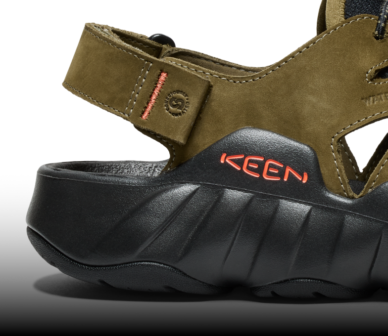 A close-up of the sole of an olive green Hyperport sandal.