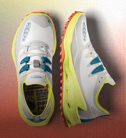 Close up of Zionic hiking shoes on orange gradient background
