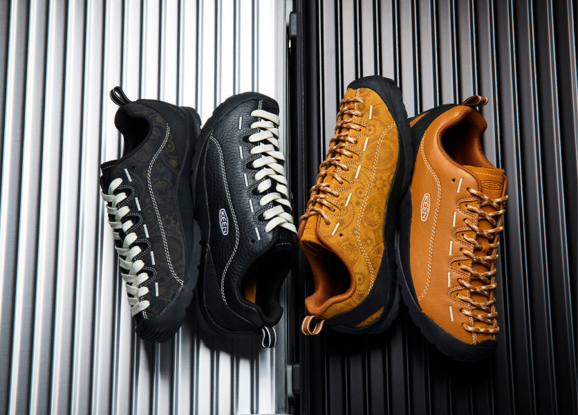 A brown pair and a black pair of the KEEN and THC collaboration Jaspers on metal sheet