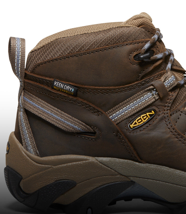 A close-up of a brown KEEN Targhee boot featuring KEEN.DRY waterproof material.
