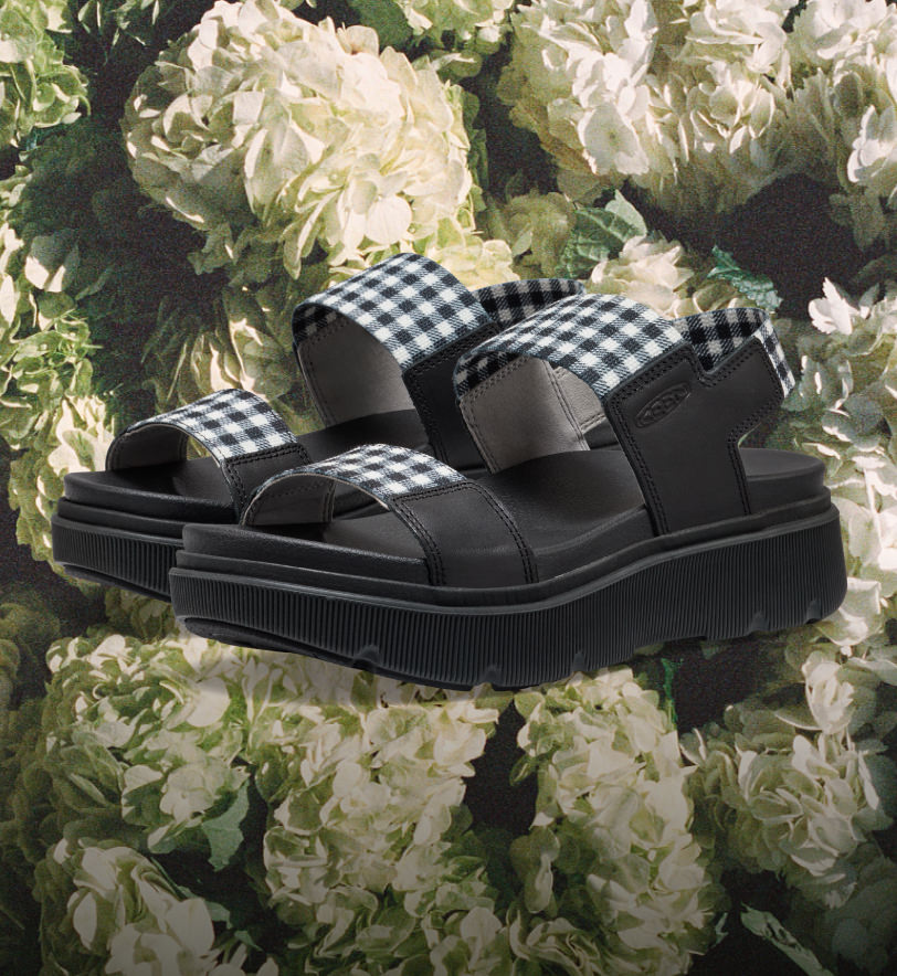 Product shot of the new women's Elle Mila sandal in black with black and white checkered straps.