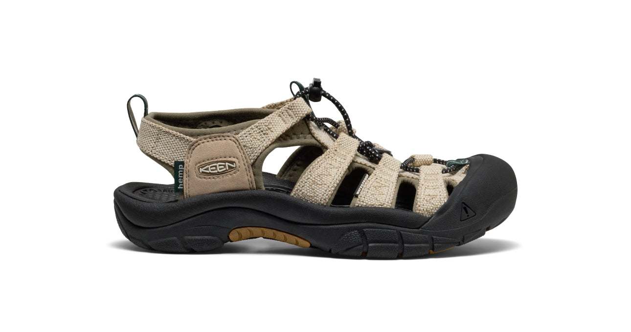 Studio product shot of men's tan KEEN x Gramicci collaboration hiking sandal against white background.