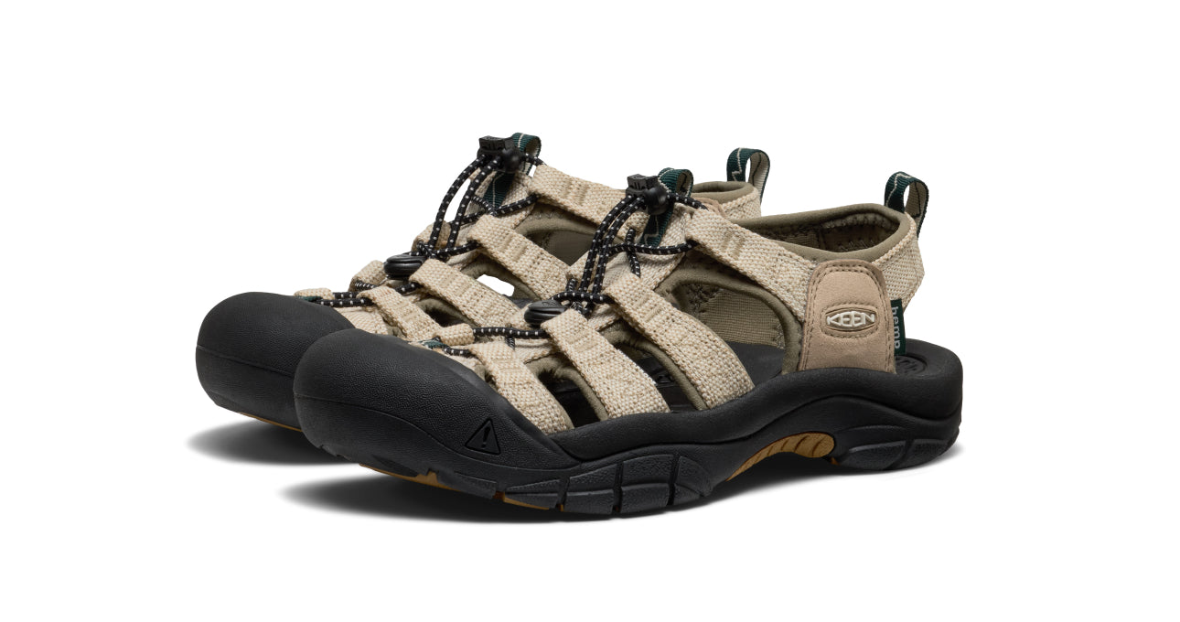 Studio product shot of women's tan KEEN x Gramicci collaboration hiking sandals against white background.