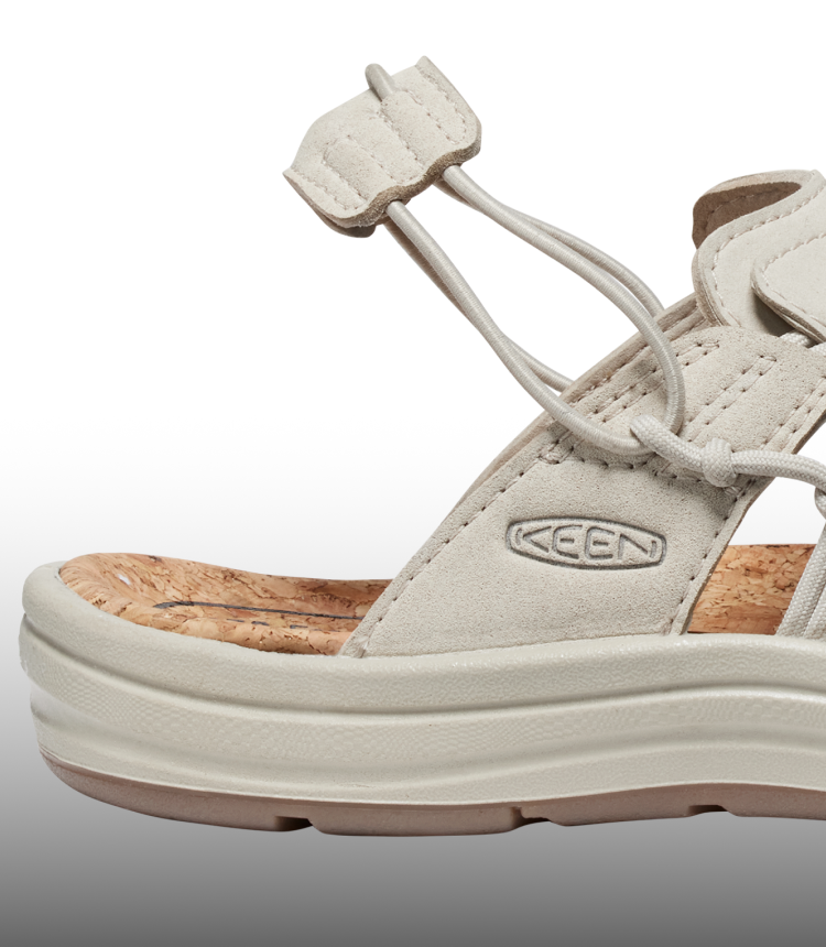 A close-up of the heel of a cream-colored KEEN UNEEK sandal.