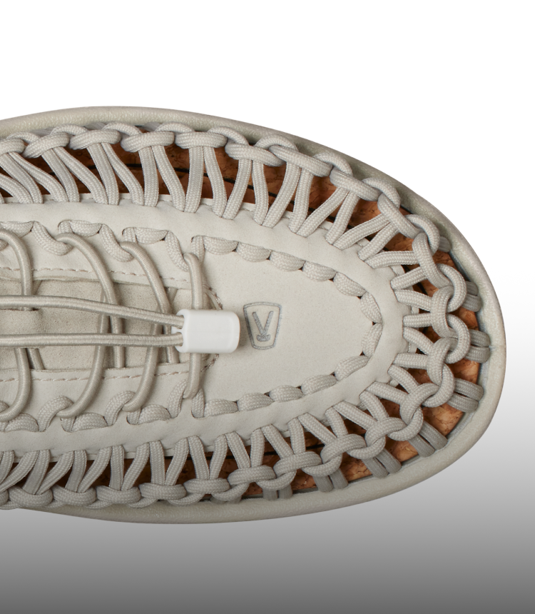 A close-up of the top of a cream KEEN UNEEK sandal.