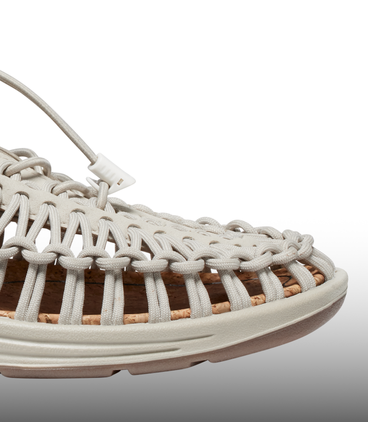 A close-up of a white KEEN UNEEK sandal.