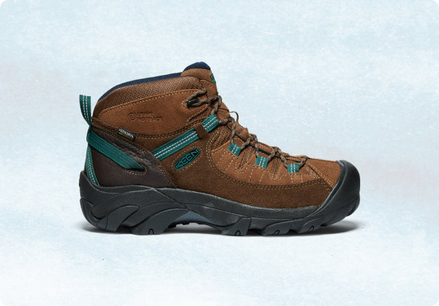 A brown KEEN Pyrenees hiking boot with a thick, black sole.